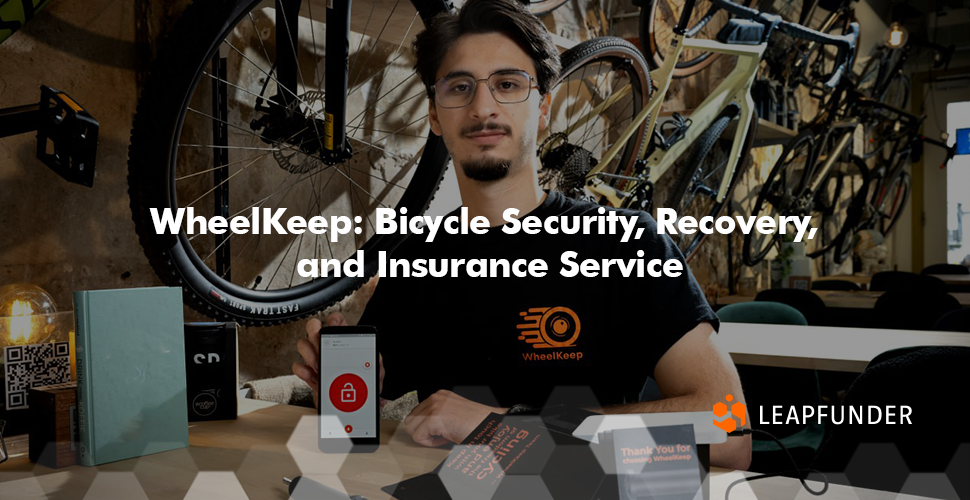 A man posing for a business photo, showing his bike security product